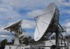 Two large satellite dishes on a sunny day