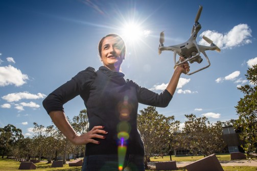 Associate Professor Zahra Gharineiat holding a drone, of the kind used in the microcredentials skills courses.