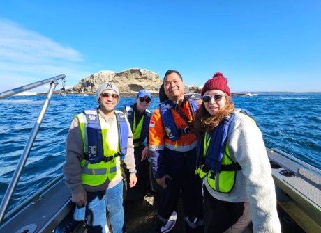S-5B students, including Yudovan Vidyan (in the orange overalls), on board the survey vessel in Portland, during the hydrographic surveying training course.