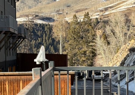 A Kurloo fixed to a fence, with the Rocky Mountains in the background