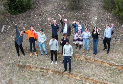 An overhead view of 12 people taking part in the Let's Locate surveying immersion program
