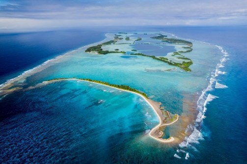 An aerial image of a coral atoll