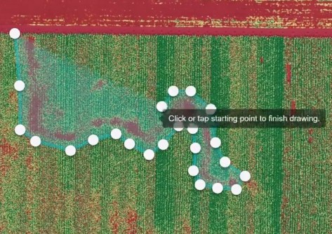 An aerial image of a farming field, with dots overlaid representing positions measured using an RTK network