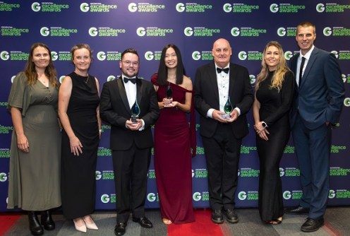 A line up of seven people at the Geospatial in School Awards ceremony