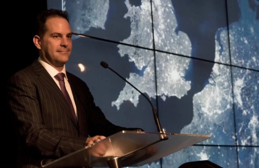 Dr Stuart Minchin standing at a lectern