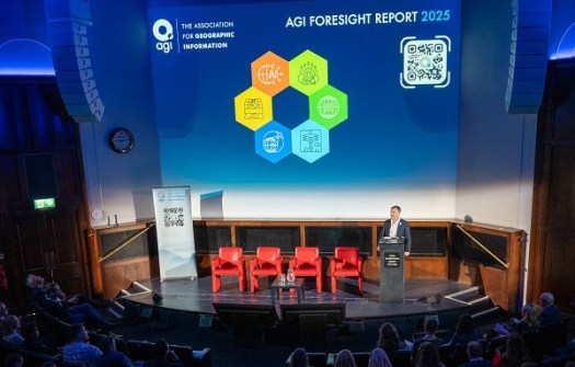 A man standing on a stage in front of a seated crowd, during the launch of the Foresight Report