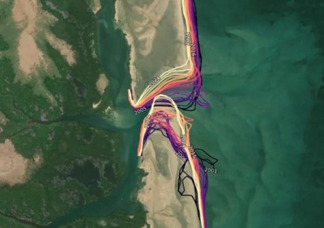 A satellite image from Digital Earth Africa of a river flowing into the sea, with lines marked indicating where the shoreline was in different years.