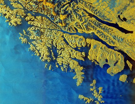 A Sentinel-1D satellite image of Tierra del Feugo, showing the landmasses in yellow and the sea in blue