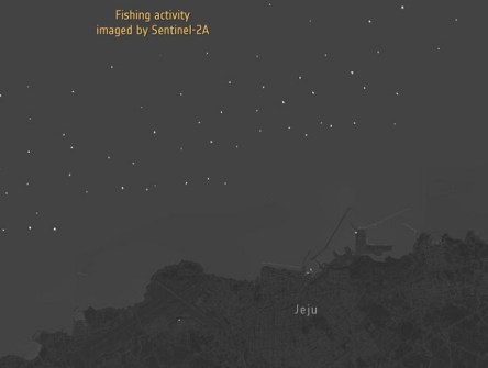 Nighttime imagery from Sentinel-2A of the sea off the coast of the South Korea, showing a scattering of small white dots, which are the lights of fishing boats.