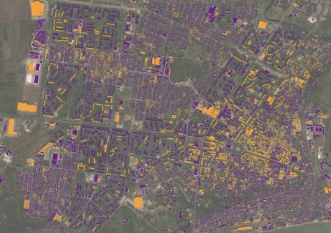 A satellite image of Mariupol, with building destruction indicated using different colours