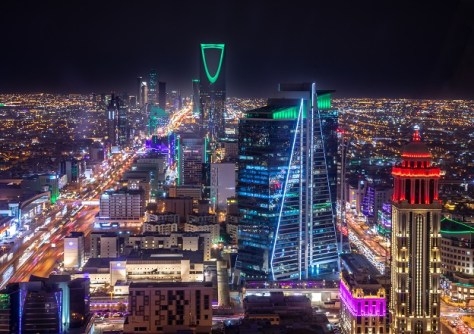 A nighttime image of the skyline of Riyadh, in which city the World Geospatial Information Congress will be held.
