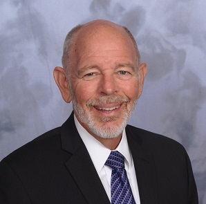 A head-and-shoulders image of Dana Goward, an expert in resilient PNT