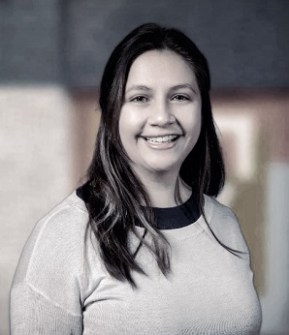 Head-and-shoulders image of Ari Comben, who uses GIS for preparing for disasters