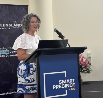 Spatial data expert, Cherie Malone, standing at a lectern