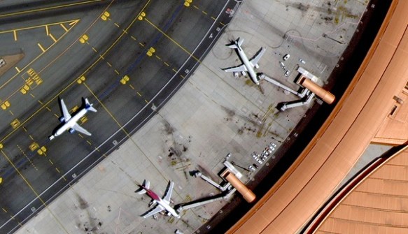A SpaceEye-T satellite image showing and overhead view of aircraft at airport gates, and taxiing.