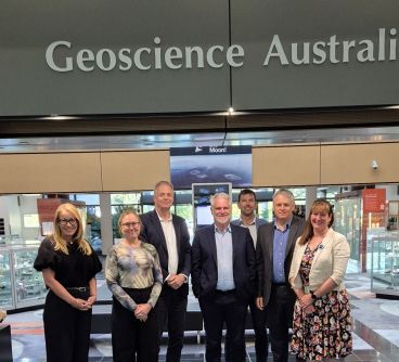 Seven men and women, members of the new NGAC, standing in a line facing the camera