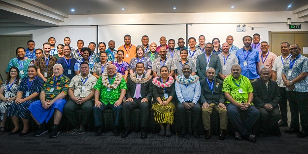 About 45 people pose for a group photograph at the 7th Pacific Geospatial and Surveying Council (PGSC) meeting