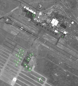 A satellite image of Alice Springs airport, showing green boxes around aircraft that were detected by the on-board AI system