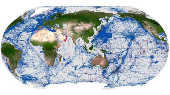 A map of the world, with crisscrossing blue and red lines indicating where the ocean floor has been mapped