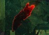 A satellite image showing green forested area with a large chunk in the middle glowing red, where there is a large fire