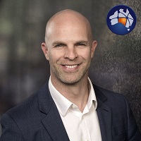 A head-and-shoulders photo of a man who will speak at Spatial Information Day