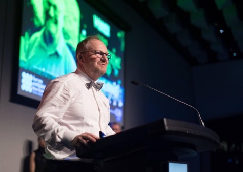 A man standing at a lectern during the S+SNZ awards