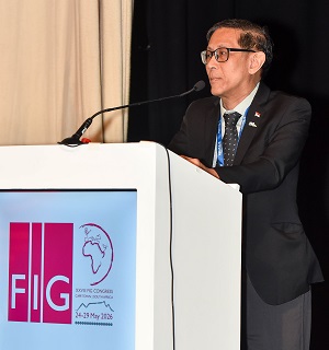 A man speaking into a microphone at a lectern
