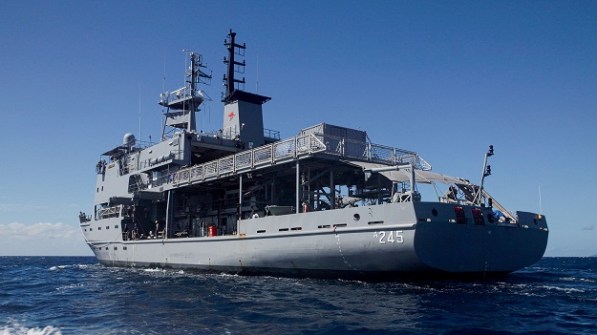 A view of HMAS Leeuwin at sea, taken from water level off the left stern of the ship