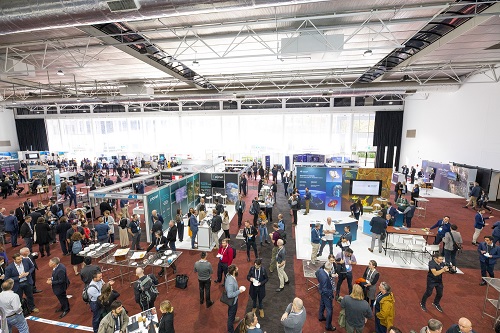 An overhead view of the exhibition area at a Locate conference