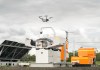 A RocketDNA drone taking off from is storage box