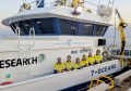 A group of Revelare Hydrospatial team members aboard a boat