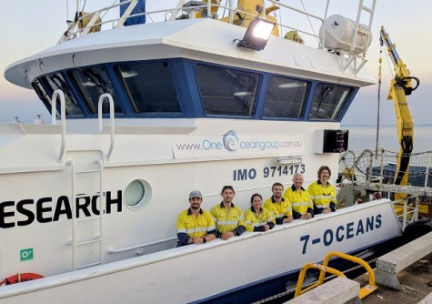 A group of Revelare Hydrospatial team members aboard a boat