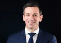 A head-and-shoulders photo of Geoscape's CEO, Dean Capobianco, set against a black background