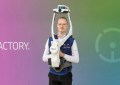 A man wearing a NavVis mobile laser scanning device