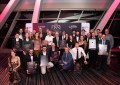 A group of people holding awards