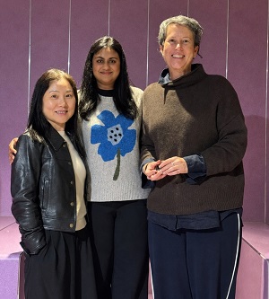Three women standing close together