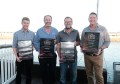 Four men holding EISSI Award plaques