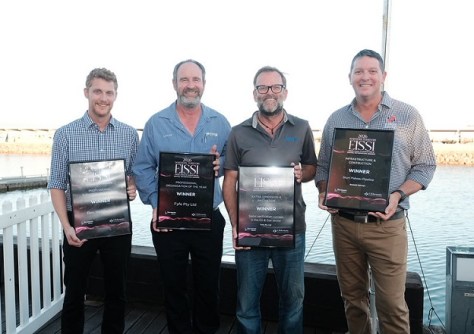 Four men holding EISSI Award plaques